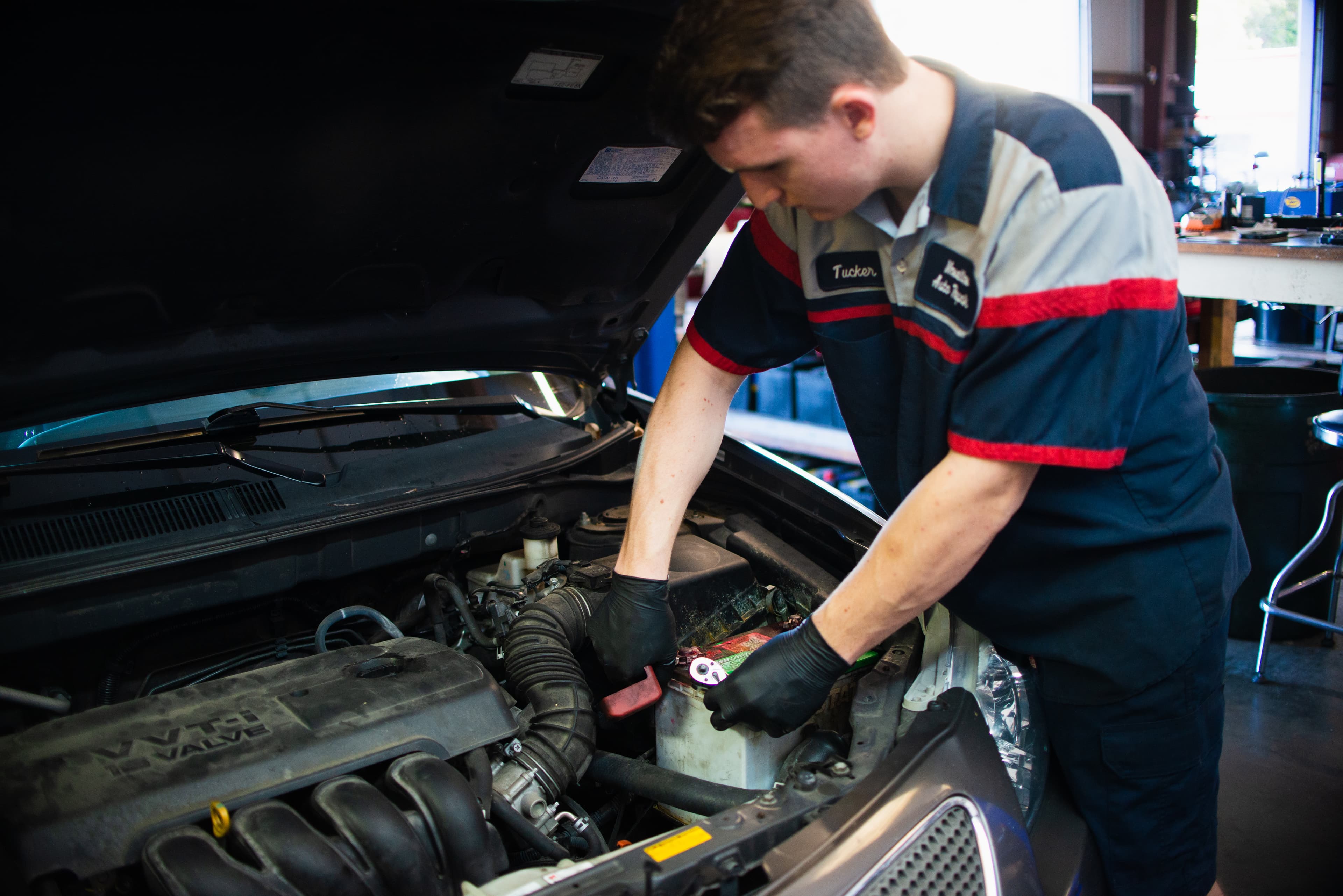 Masella's Auto Repair technician working under the hood in the shop